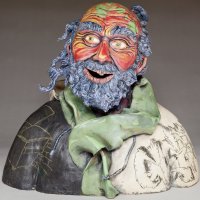 front view of ceramics sculpture of homeless man